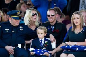 Family mourns at a police funeral.