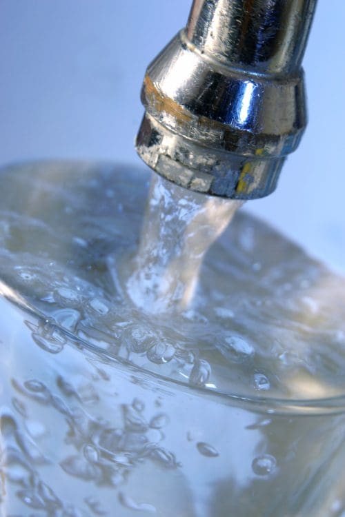Water flowing into a glass.