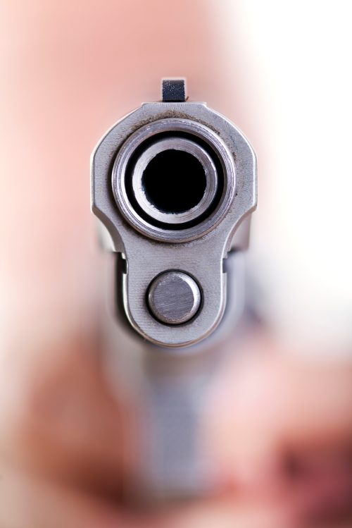 Gun barrel, close-up, dangerous weapon.