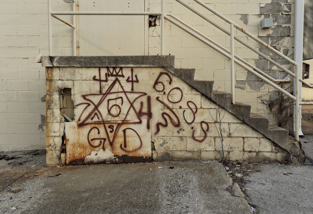 Graffiti on a brick stairwell.