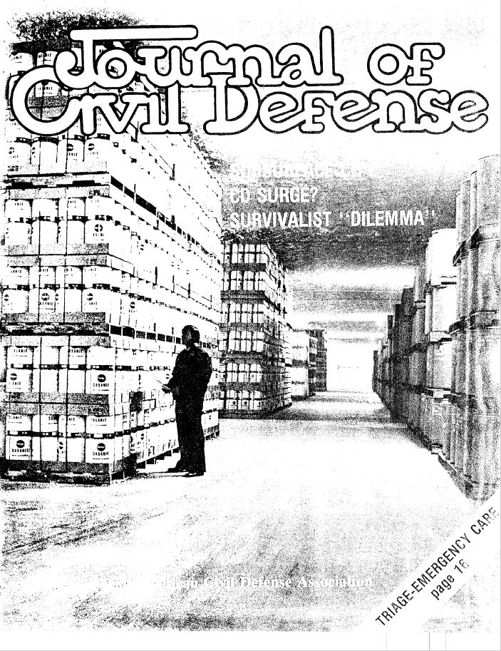 A man standing in front of stacks of boxes.