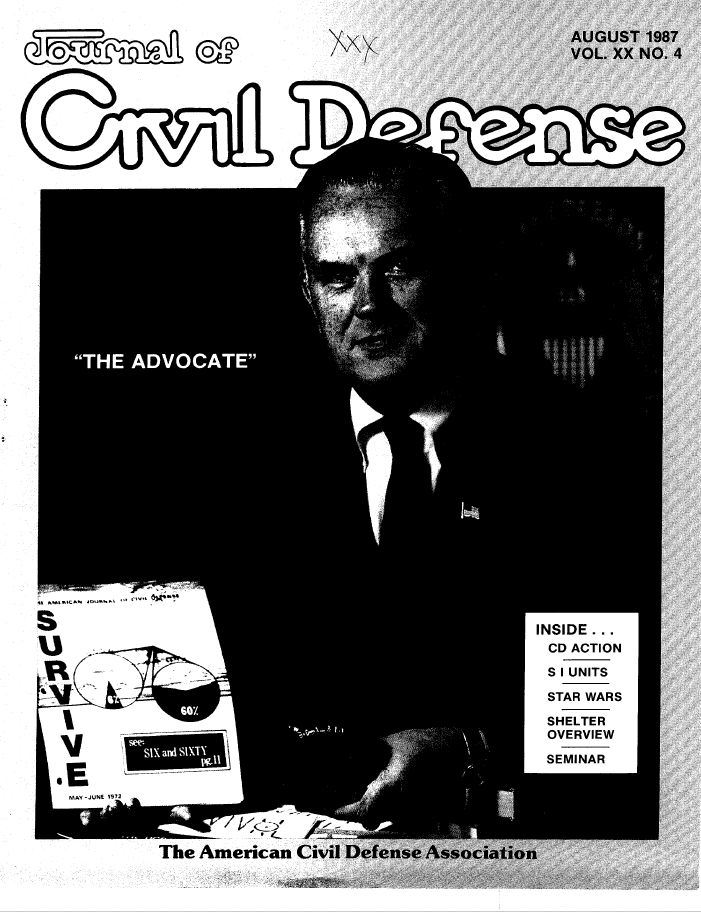 A man in suit and tie holding papers.