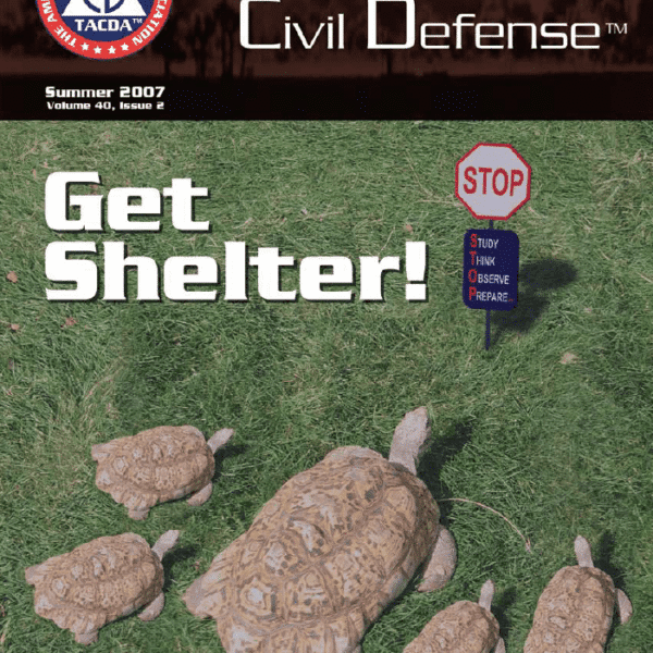 A group of turtles in the grass with a sign.