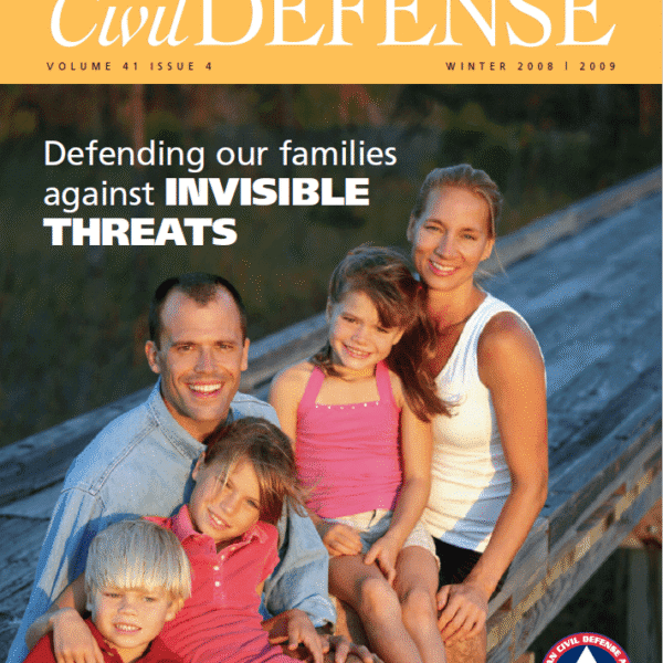 A family of four posing for the cover of civil defense magazine.