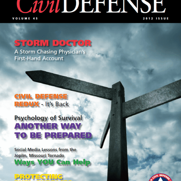 A magazine cover with a cross and sky in the background.