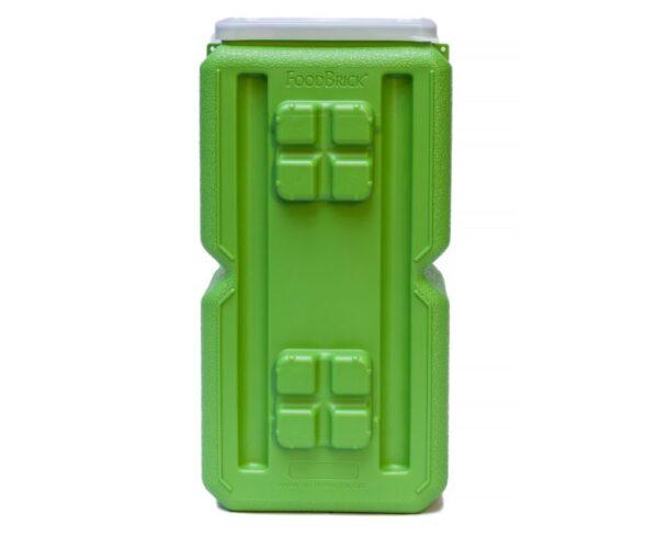 A green container with four windows on it.