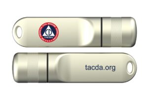 A flash drive with the Tacda logo