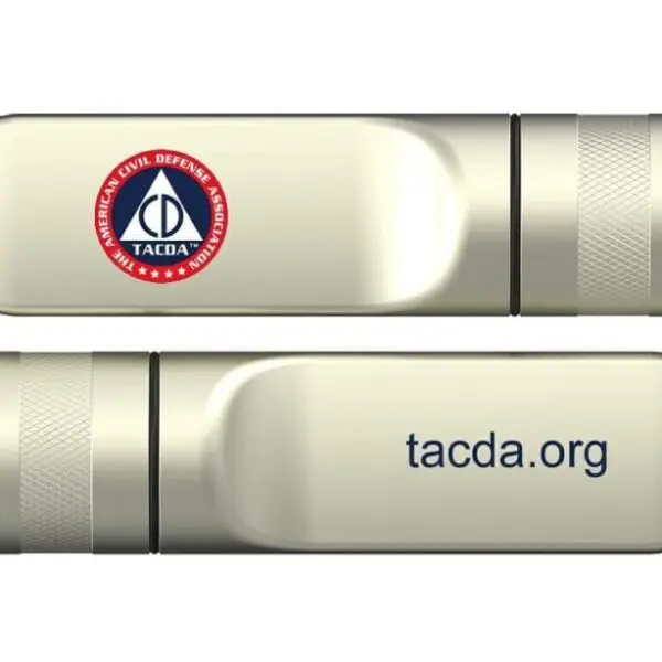 A silver usb flash drive with the logo of tacda. Org