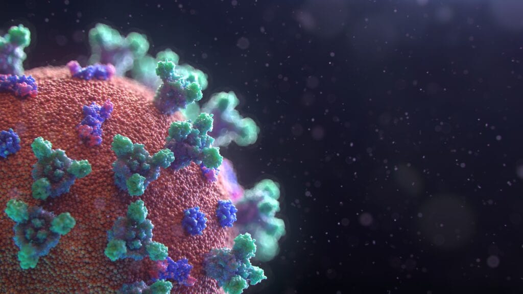 A close up of the coronavirus on a black background