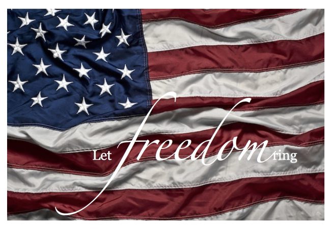 A flag with the words let freedom be written on it.