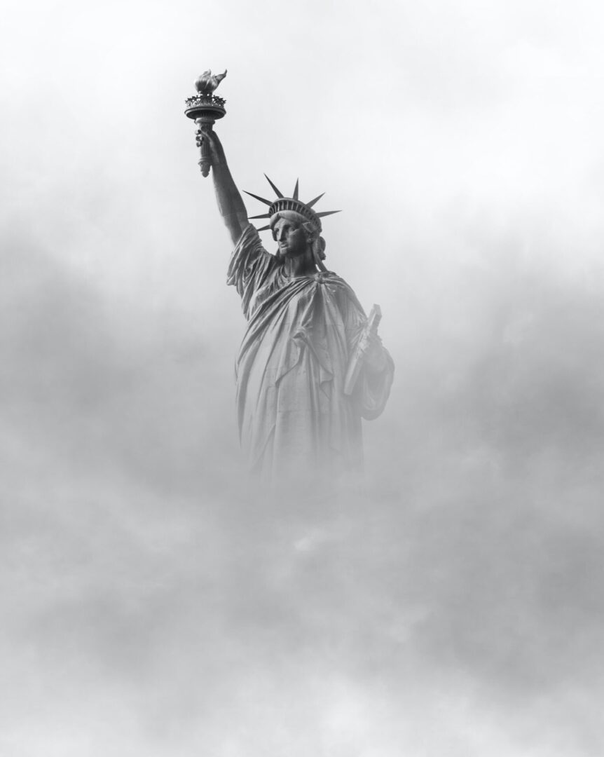 the statue of liberty surrounded by fog