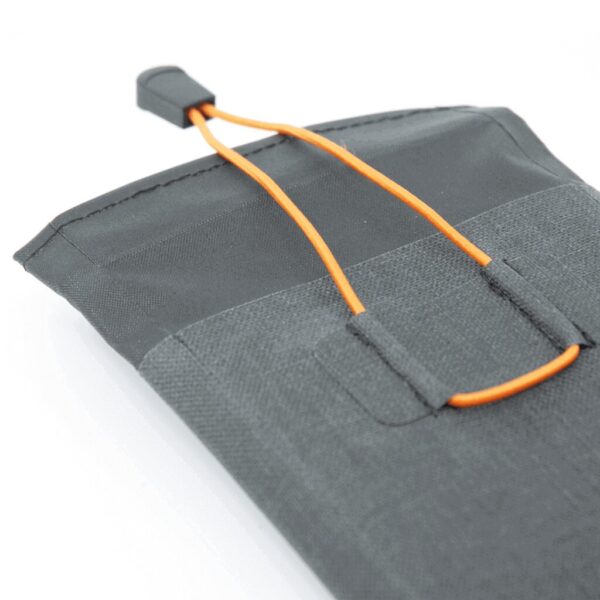 A gray bag with an orange cord hanging from it.