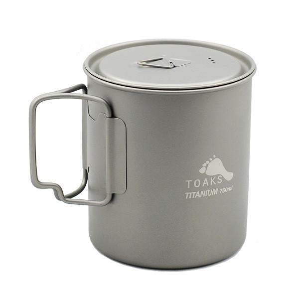 A silver mug with a handle and lid.