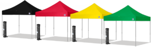 A red and yellow tent set up in the dark.