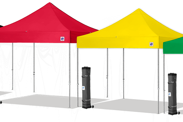 A red and yellow tent set up in the dark.
