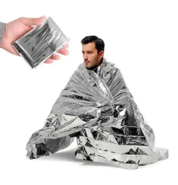 A man wrapped in silver foil and holding onto a box