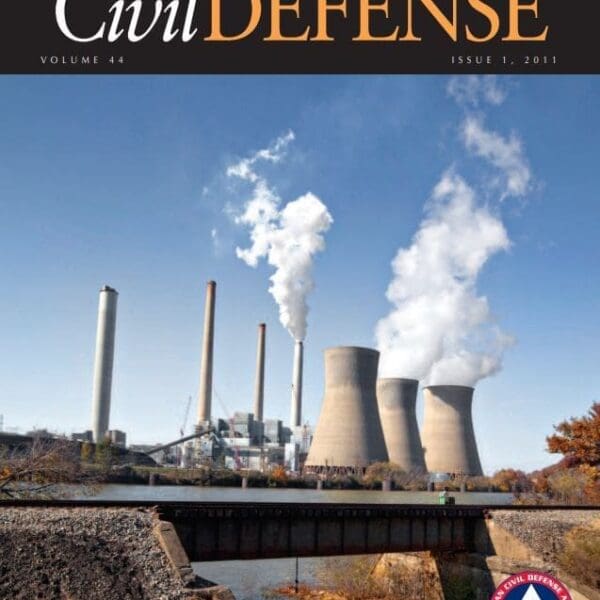 A cover of civil defense magazine with smoke coming from the stacks.