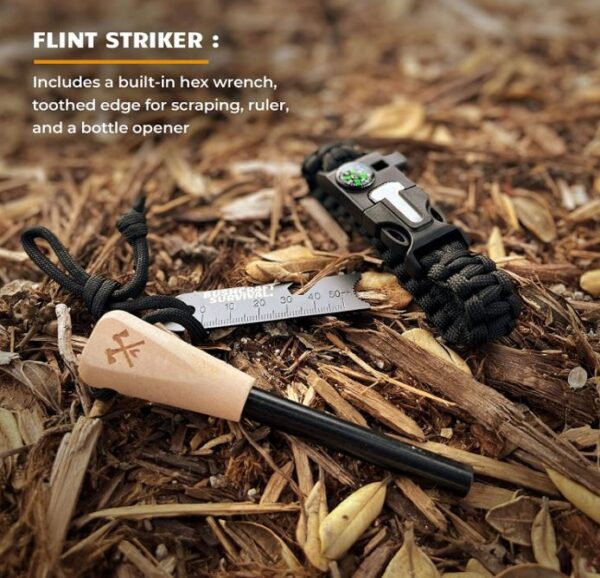 A pair of wooden knifes and a black paracord bracelet laying on the ground.