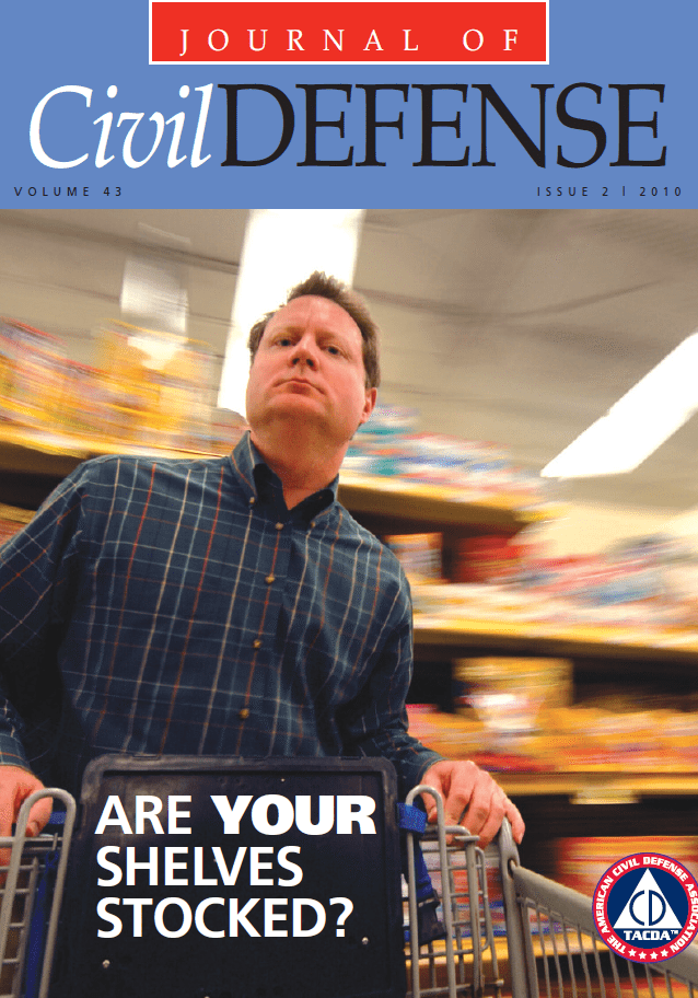 A man in a grocery store with a cart.